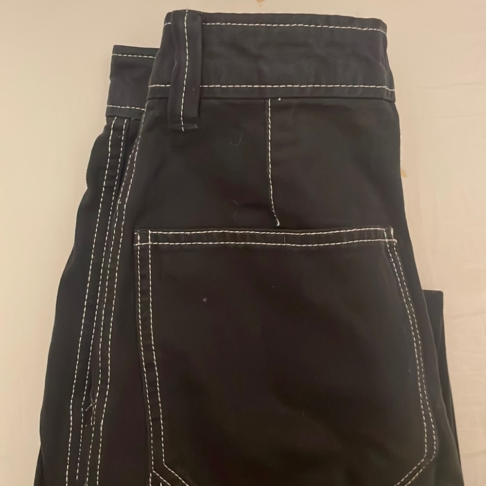 Black cargo pants with white stitching